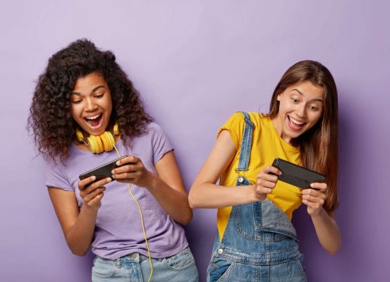 Women playing video games on Giganet's full fibre broadband