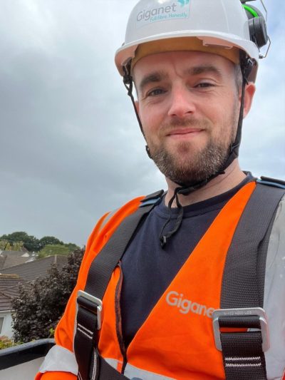 Chris our Giganet fibre Installation Engineer wearing orange high visibility jacket