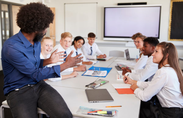 Teacher in classroom with students